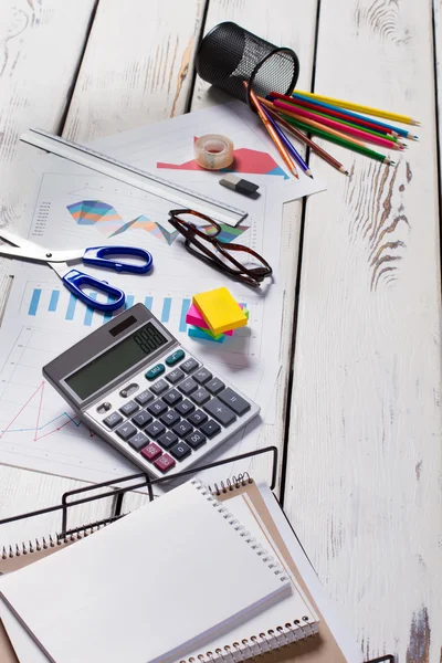 Scattered stationery on wooden table. — Stock Photo, Image