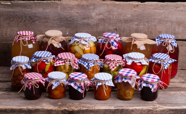 Glass jars close-up with fruits and vegetables. — Stock Photo, Image