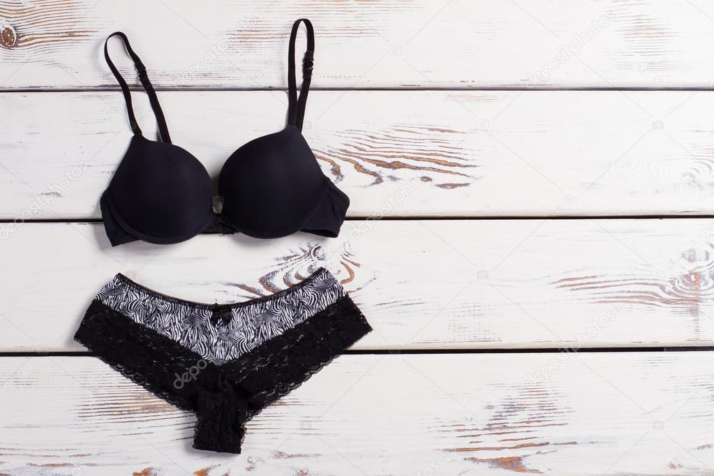 Black lingerie on a wooden background. Stock Photo by ©margostock