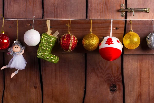 Heldere Nieuwjaar garland op een houten achtergrond. — Stockfoto