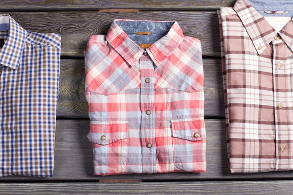 Three different checked shirts.