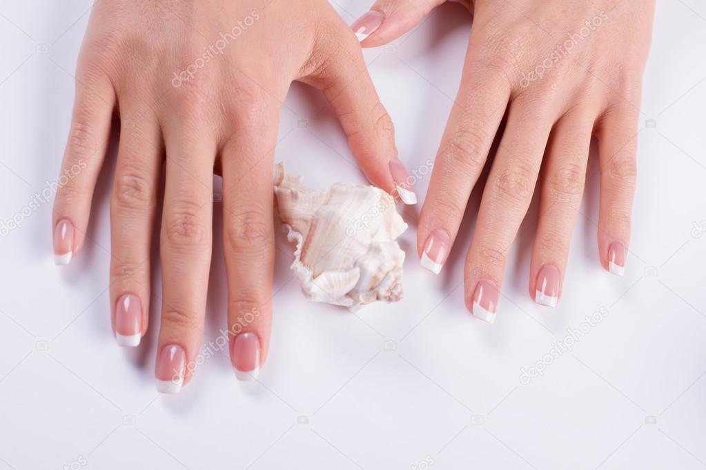 Manicure and delicate pearl shell.