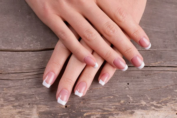 Female hands with french manicure. — Stock Photo, Image