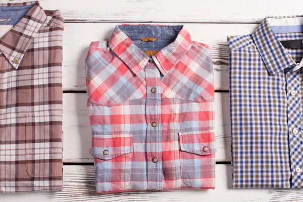 Three different checked shirts.