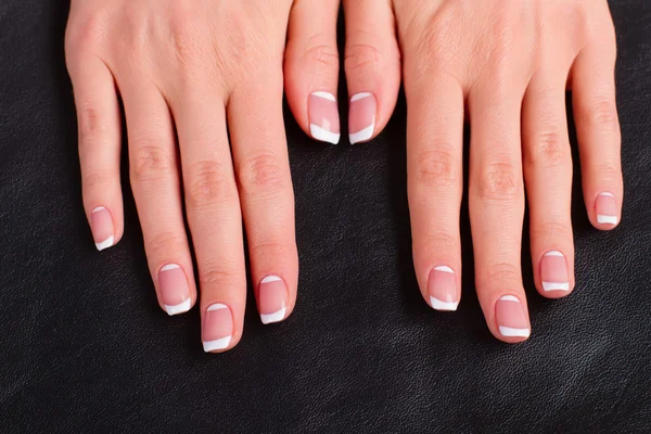 Women's hands with a stylish french manicure. — Stock Photo, Image