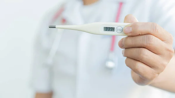 Handheld digital thermometer, body thermometer and self health check and medical concept