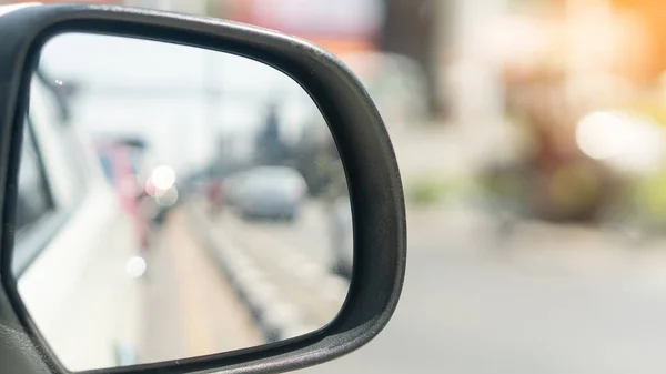 Right side car mirror that can be seen behind