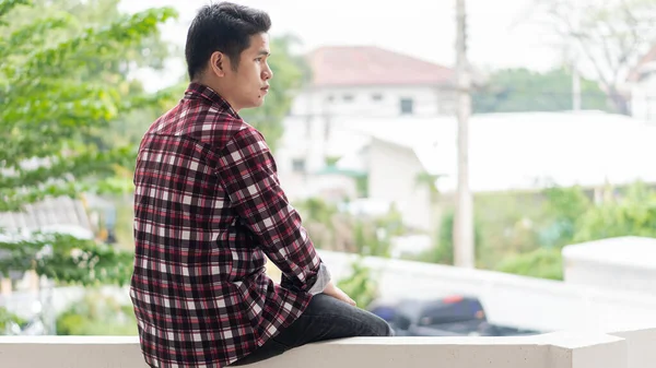 Young Man Sat Wall Tower Alone Had Sad Face — Stock Photo, Image