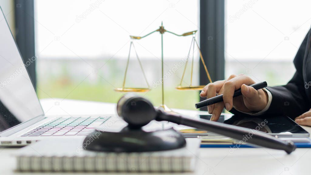 Office attorney advisor with judge hammer and justice scales plus attorney concept laptop and legal adviser