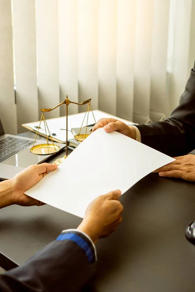 Lawyers discuss contract documents. Sit at a desk in the office of ideas and legal advice. legal services Businessman and male lawyer or judge consult with client team with portrait pictures.