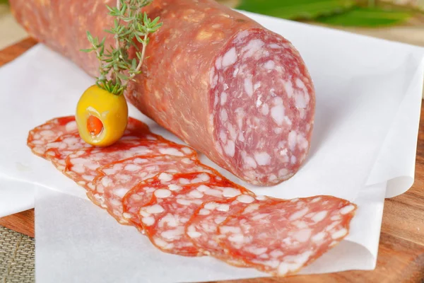 Salami with olive — Stock Photo, Image