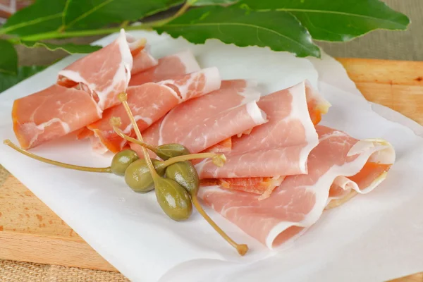 Sliced prosciutto meat — Stock Photo, Image