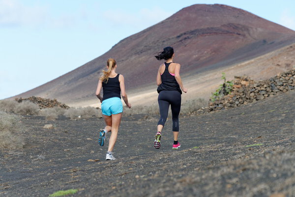 Two female running athletes.