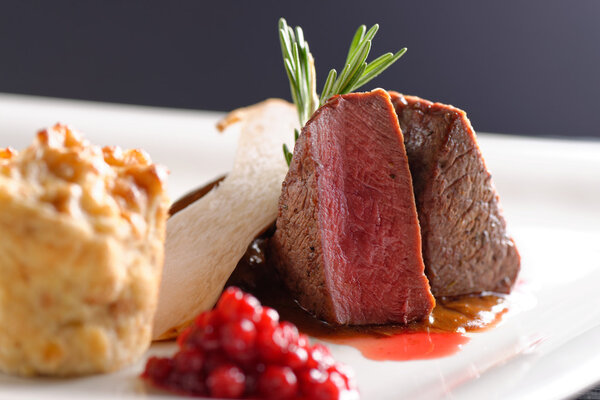 Venison meat steak with red cabbage