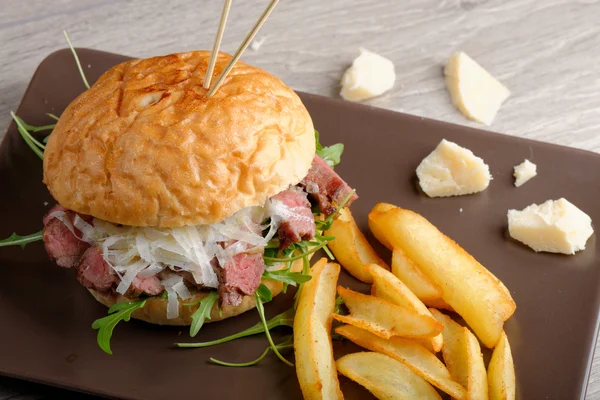 Gourmet burger with roast beef and potatoes