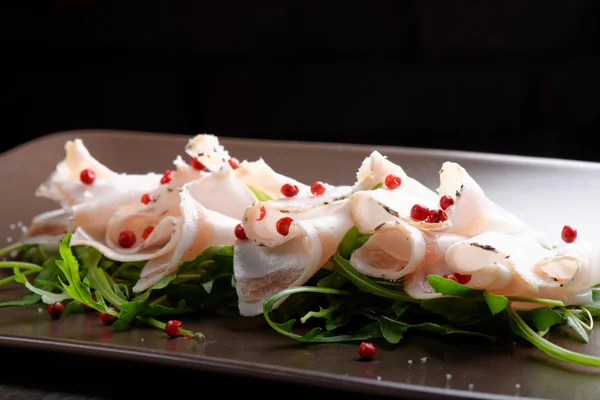 Slices of bacon with red pepper — Stock Photo, Image