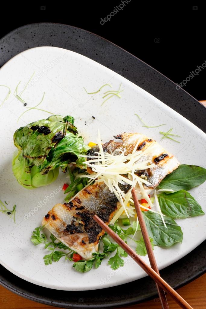 Grilled sea bass fillet with ginger, fresh peppers