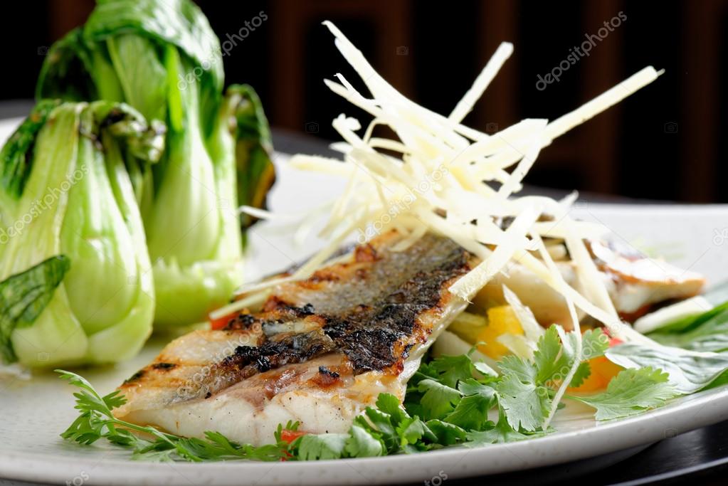 Grilled sea bass fillet with ginger, fresh peppers
