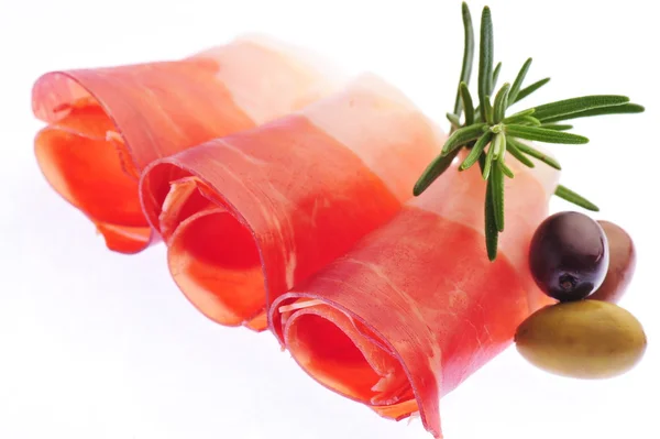 Sliced prosciutto and olives — Stock Photo, Image