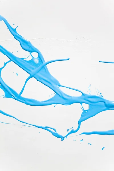 Splashes de tinta azul sobre um fundo branco — Fotografia de Stock