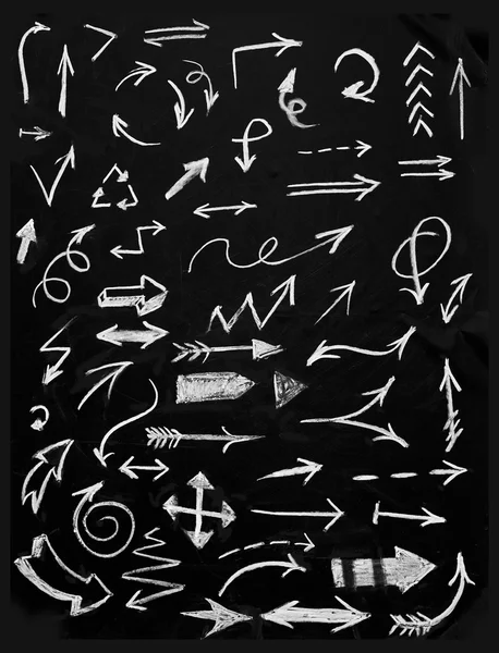 Set of chalk arrows isolated on black background — Stock Photo, Image