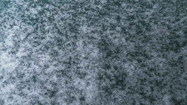 Kışın kar ve donmuş su arka planı