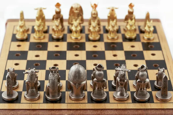 Chess board with placed chess pieces stylized as Egyptian gods — Stock Photo, Image