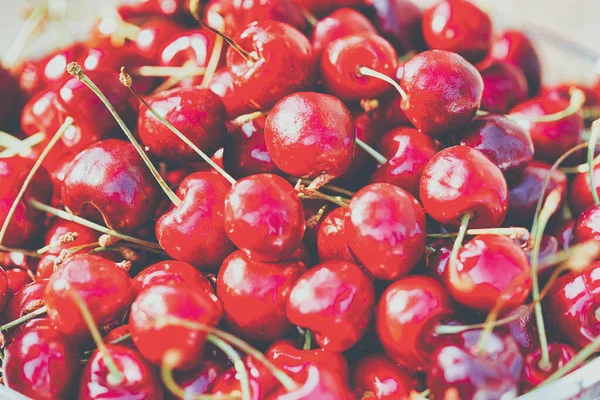 Lots of ripe red cherries in a plate — Stock Photo, Image