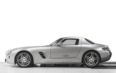 Modern sport sport car exterior - side view. Isolated on white background