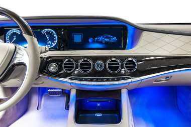 Car interior luxury dashboard with blue ambient light clipart