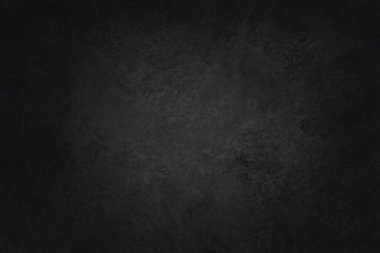Arka plan ve tasarım çalışmaları için yüksek çözünürlüklü doğal desenli koyu gri kayrak dokusu. Siyah taş duvar.