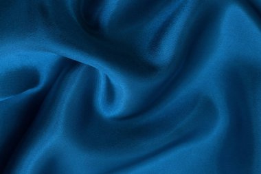Arkaplan ve tasarım için koyu mavi kumaş dokusu, güzel buruşmuş ipek ya da keten deseni..