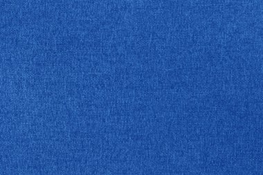 Koyu mavi kumaş dokusu arka plan, doğal tekstil yüzeyinin pürüzsüz deseni.