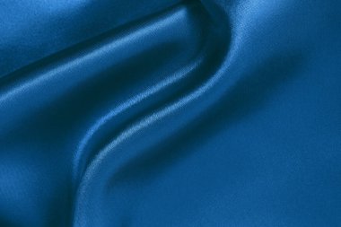 Arkaplan ve tasarım için koyu mavi kumaş dokusu, güzel buruşmuş ipek ya da keten deseni..