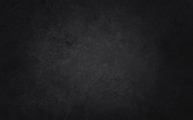 Arka plan ve tasarım çalışmaları için yüksek çözünürlüklü doğal desenli koyu gri kayrak dokusu. Siyah taş duvar.