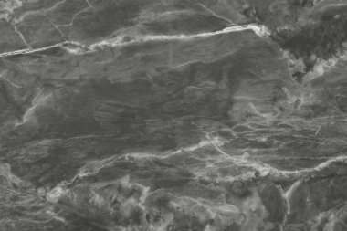 Koyu gri mermer üst görünüm dokusu arkaplanı pürüzsüz sim desenli.