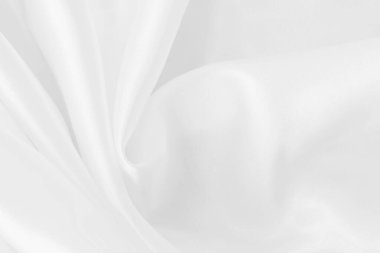 Arkaplan ve tasarım için beyaz kumaş kumaş dokusu, güzel buruşmuş ipek ya da keten deseni.