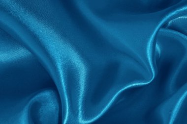 Arka plan ve tasarım için mavi kumaş dokusu, güzel buruşuk ipek ya da keten deseni.