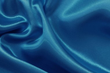 Arka plan ve tasarım için mavi kumaş dokusu, güzel buruşuk ipek ya da keten deseni.
