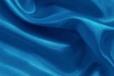 Arka plan ve tasarım için mavi kumaş dokusu, güzel buruşuk ipek ya da keten deseni.