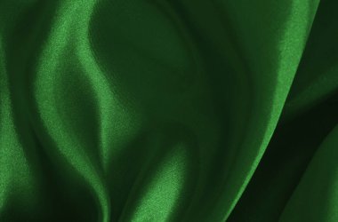 Arkaplan ve tasarım için koyu yeşil kumaş dokusu, güzel buruşmuş ipek ya da keten deseni..