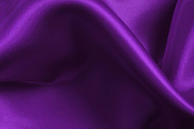 Arka plan ve tasarım için mor kumaş dokusu, güzel buruşmuş ipek ya da keten deseni..
