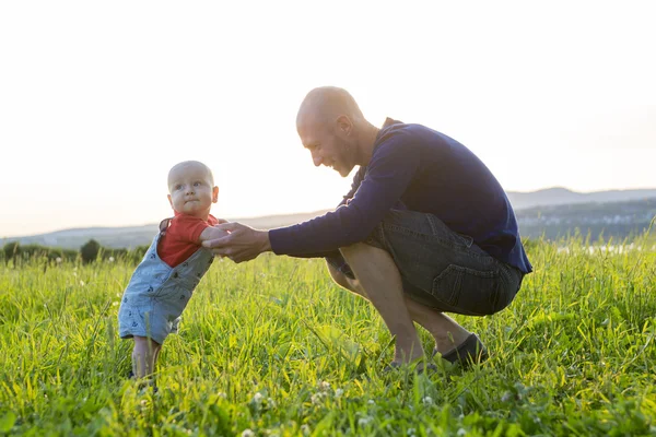 Father and baby at sunset — Stock Photo, Image