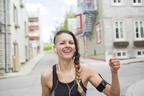 Young female runner in old city center — Stock Photo, Image