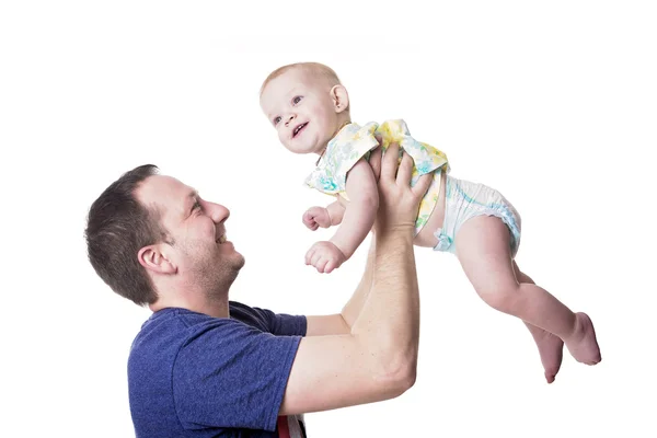 Feliz jovem pai brincando com a filhinha — Fotografia de Stock