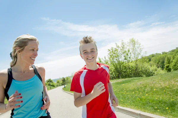 Family, mother and son are running or jogging for sport outdoors — Stock Photo, Image