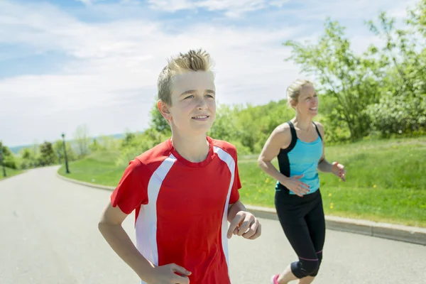 Family, mother and son are running or jogging for sport outdoors — Stock Photo, Image