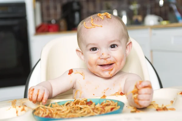 Little b eating her dinner and making a mess — Stock Photo, Image