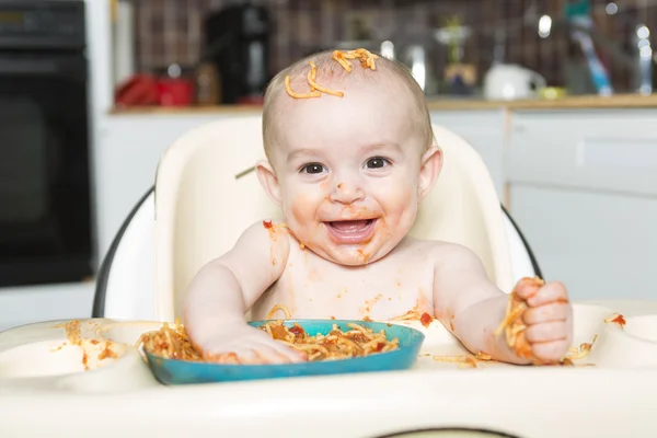 Little b eating her dinner and making a mess — Stock Photo, Image