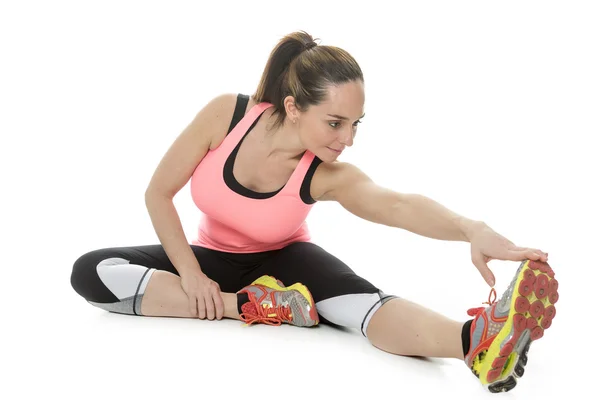 Fitness vrouw volledige lichaam uitrekken op witte achtergrond. — Stockfoto